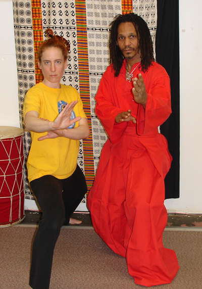 Mfundishi Tayari Casel and student Rebecca Firestone on the training floor.